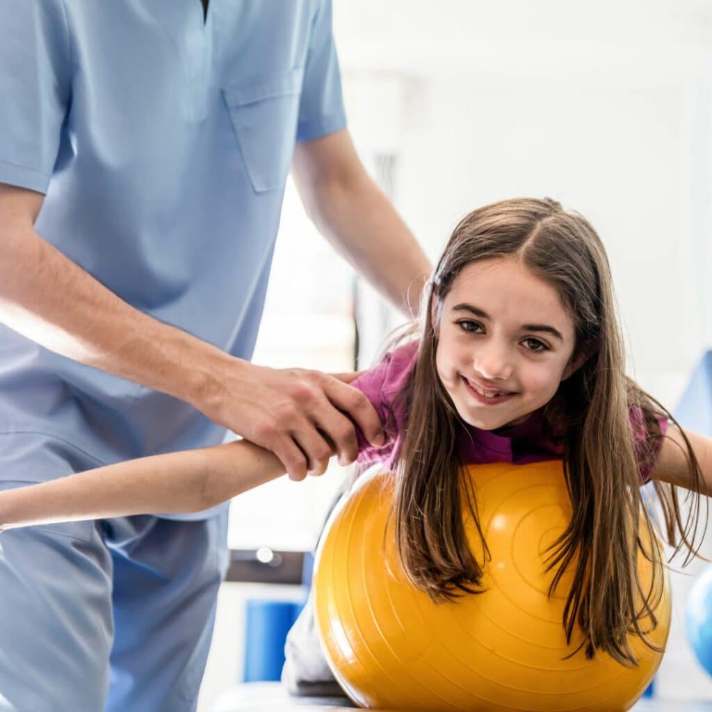occupational therapist with young girl