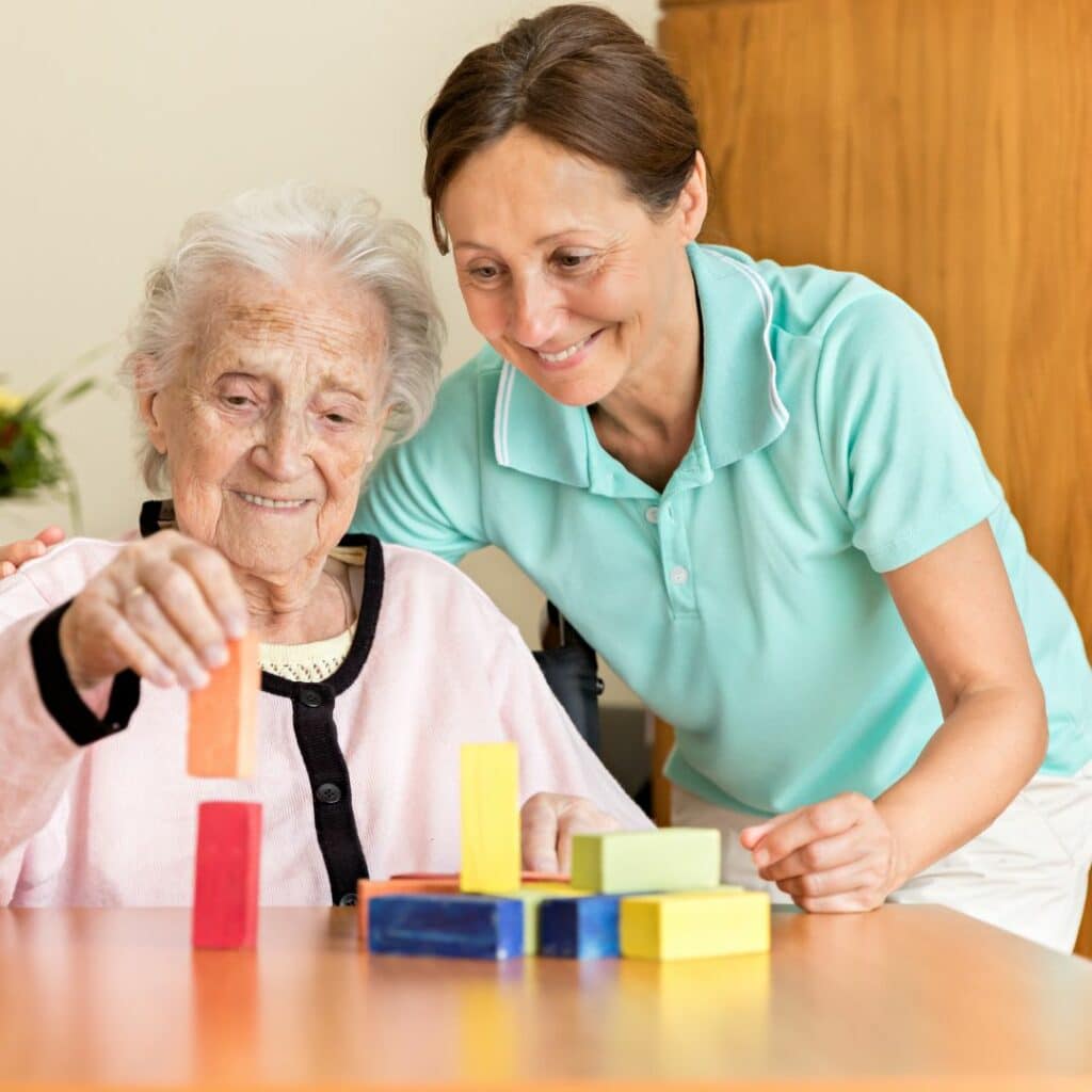 occupational therapist with client engaging in activity